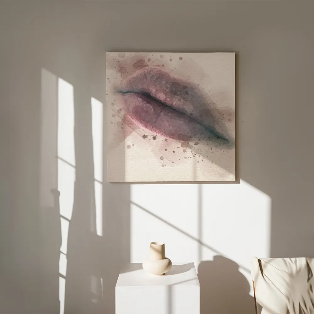 Finished canvas artwork of softly painted pink lips displayed on a sunlit neutral wall